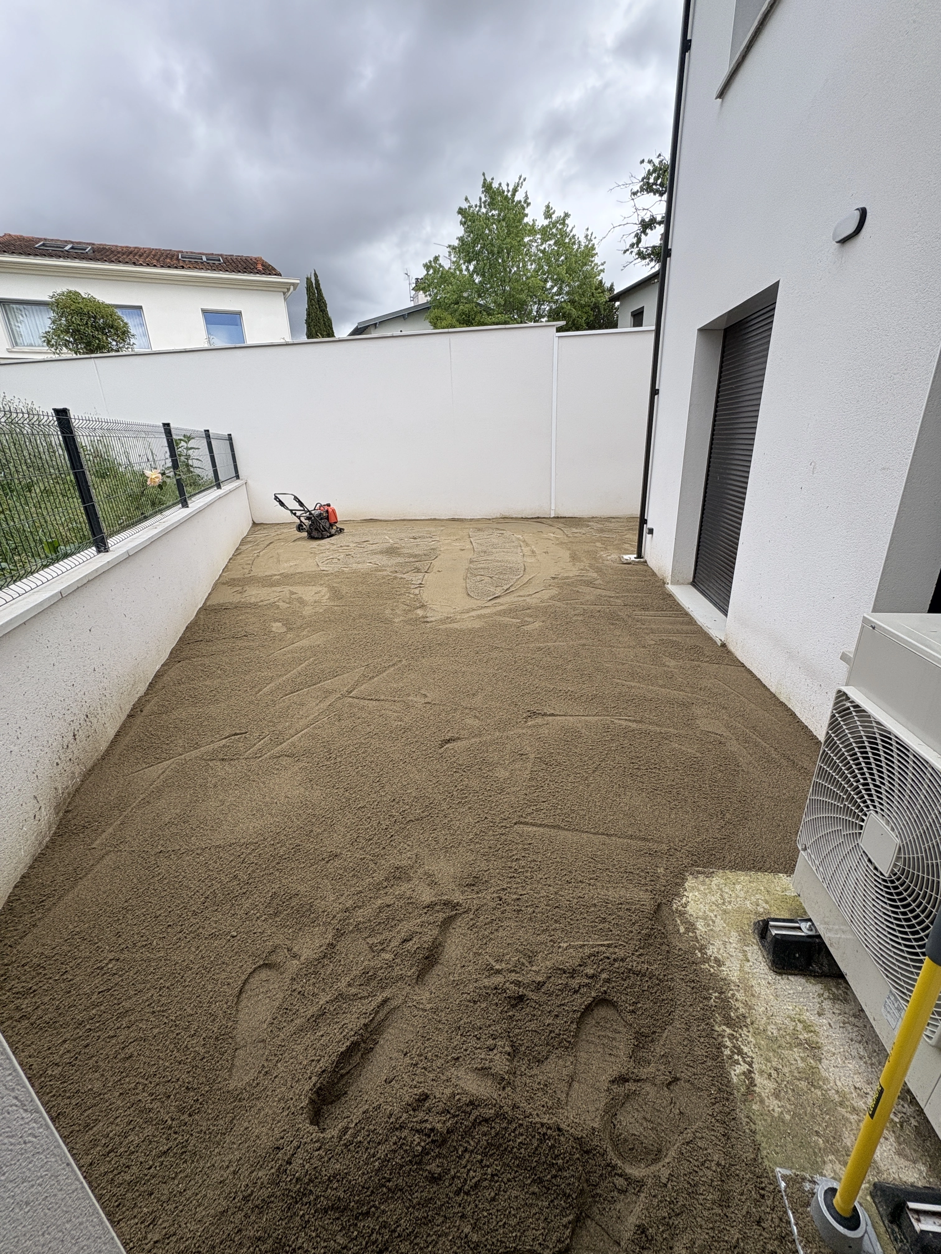Pose de la sous-couche de sable - OmniServici